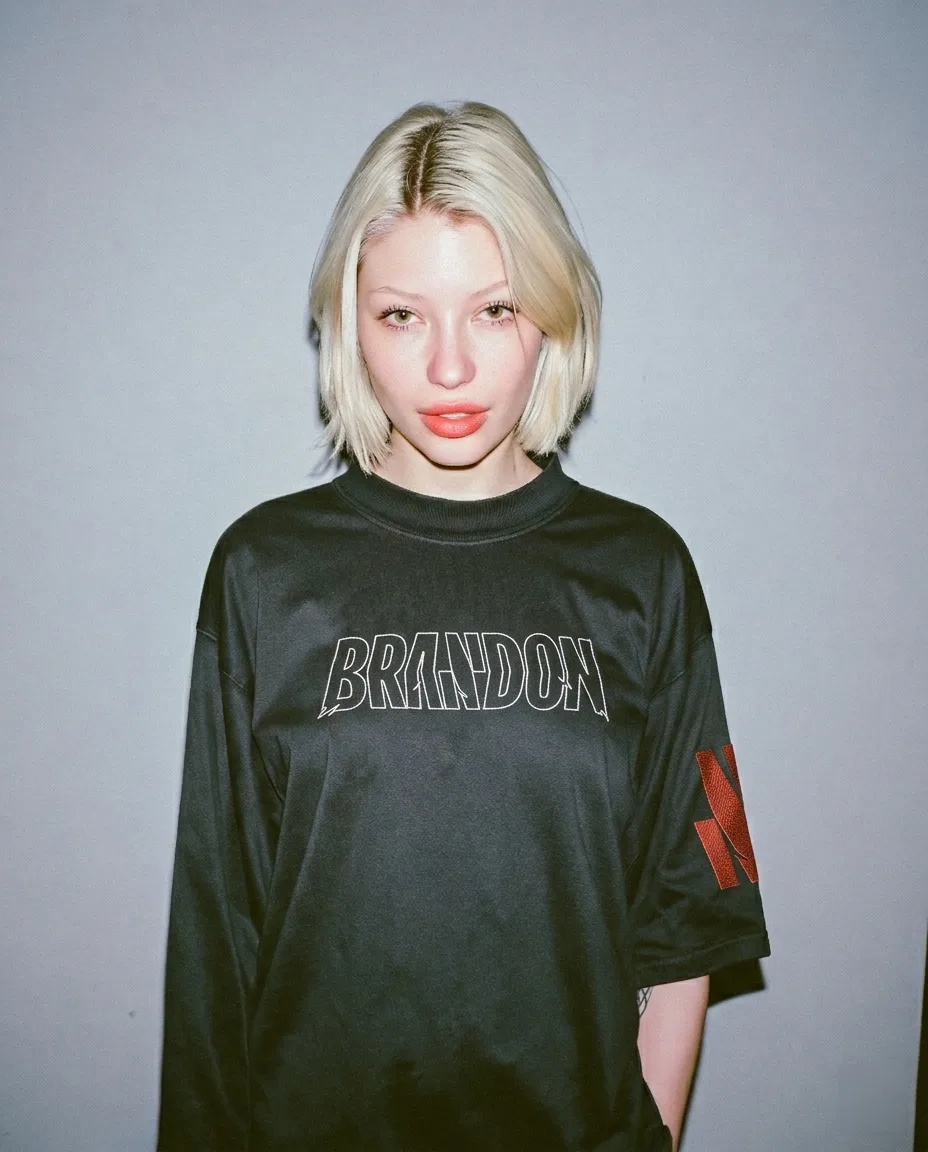 Brandon, brand identity: young woman with a blonde bob in a T-shirt with the Brandon logo