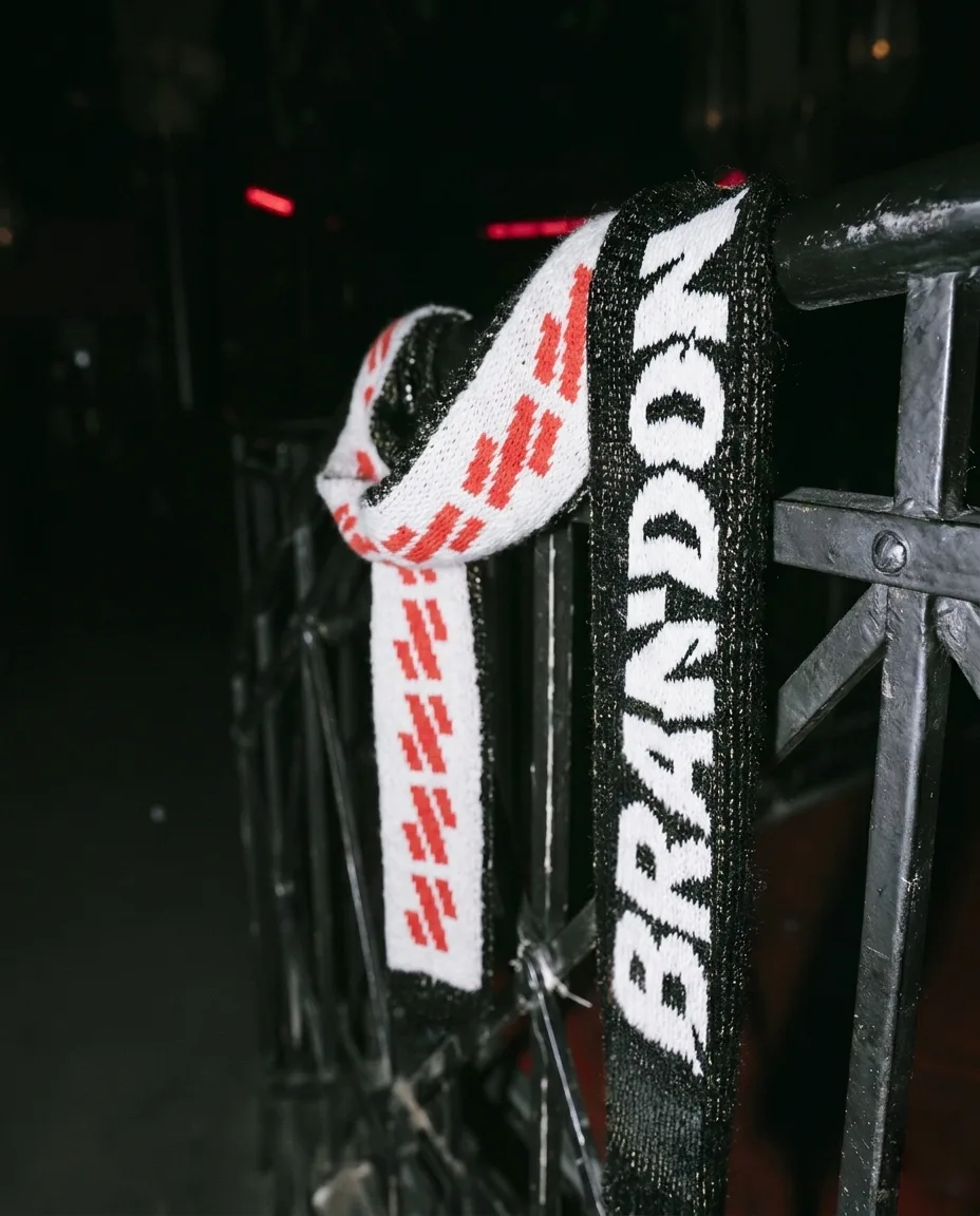 Brandon, brand identity: lanyard with the Brandon logo on a railing